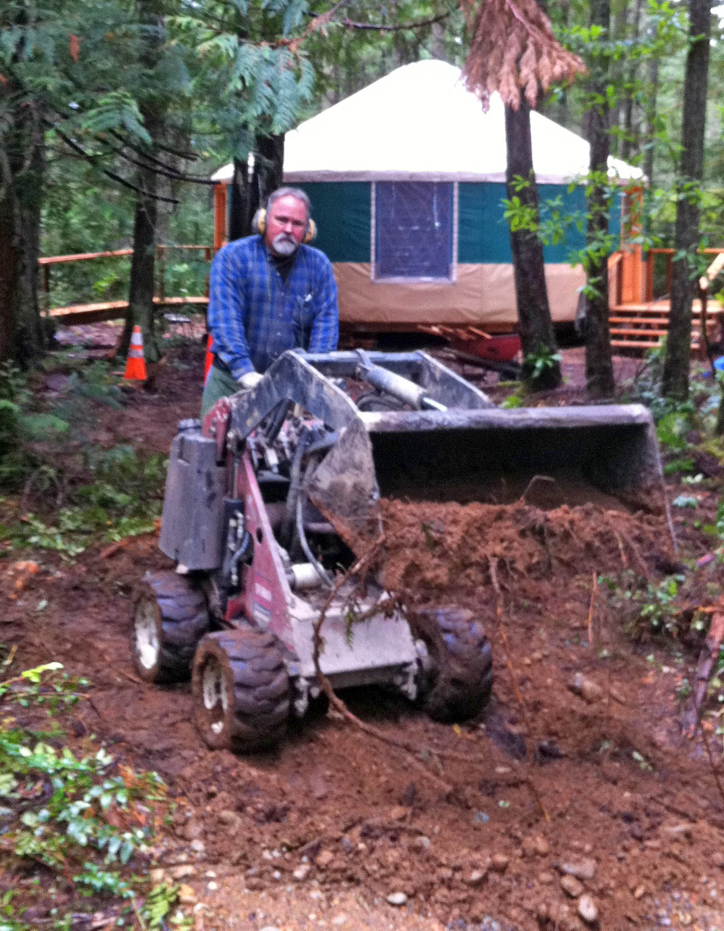 Craig McCoy filling in electrical ditch CraigOnTractorWeb
