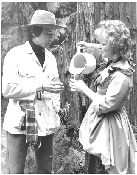 Meg (Marlene Anderson) gives Jeff (Doug Dillon) some milk