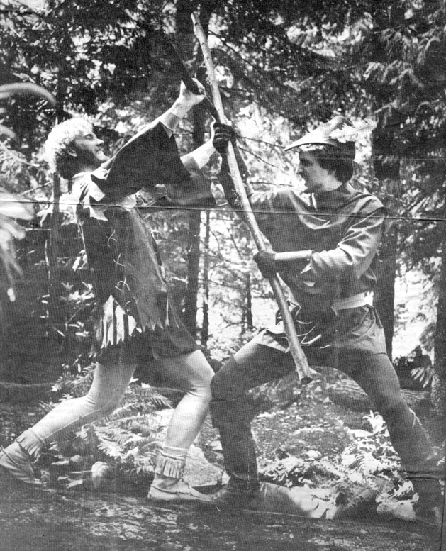 Little John and Robin test each other with quarterstaffs.