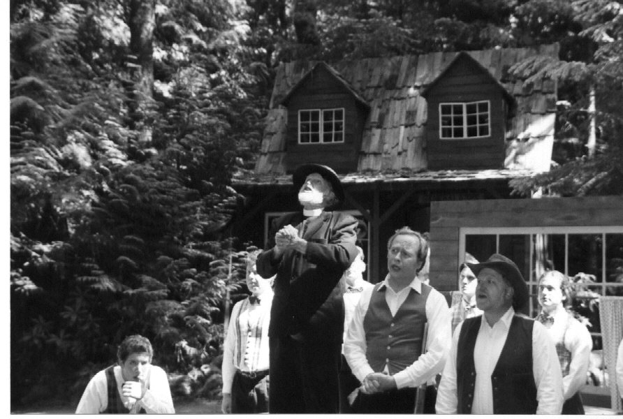 The Preacher (Ted Bradshaw) prays with Mr. Bixby (Doug Cottrill) and Mr. Perkins (Doug Thomson)