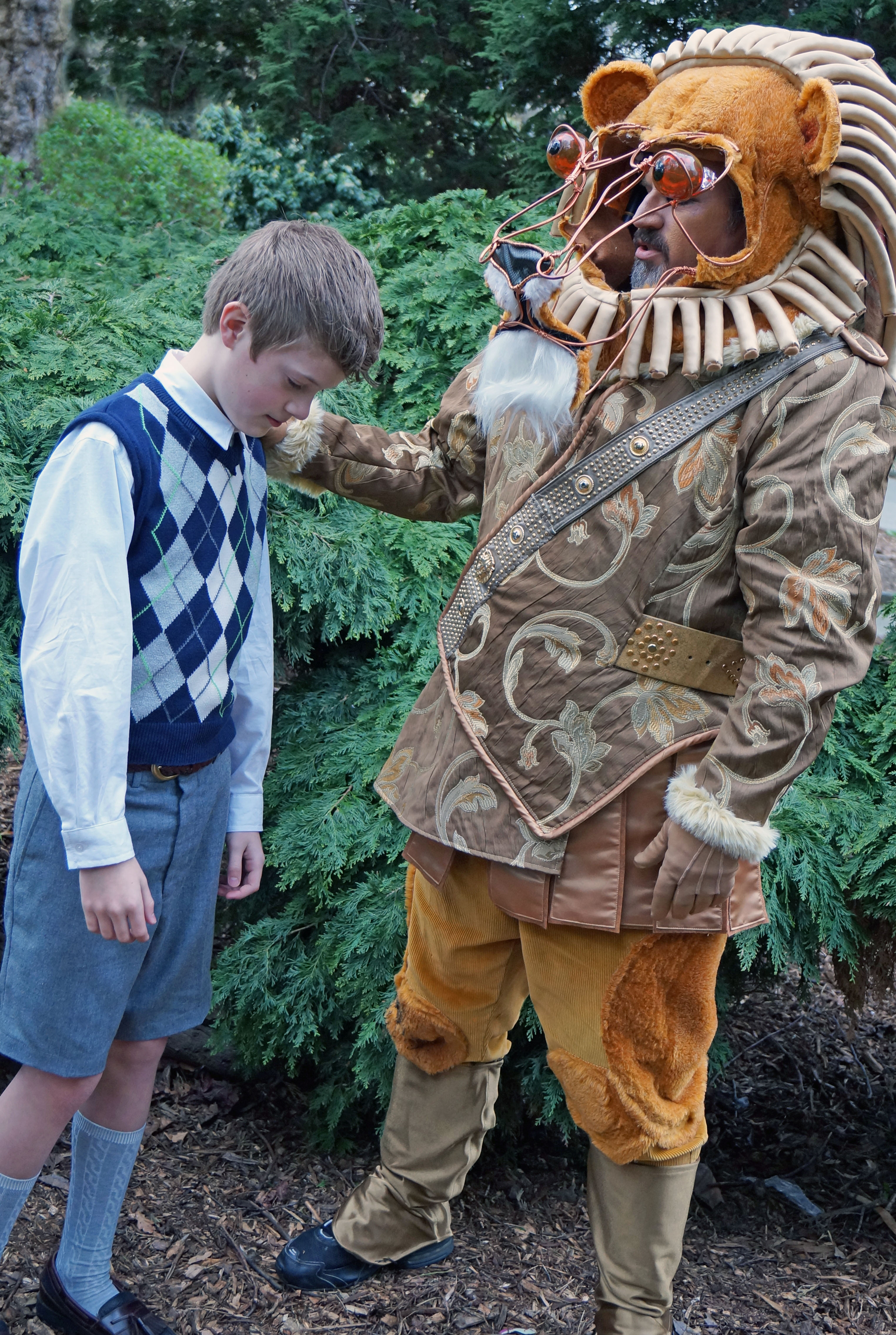 Edmund (Daniel Geiszler) confesses to Aslan (Dave Holden)